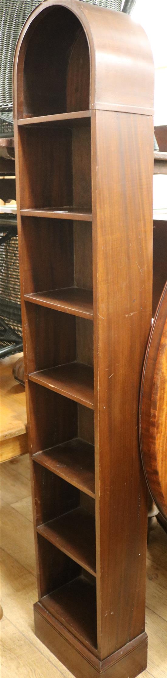 A tall narrow bookcase with arched top W.31cm